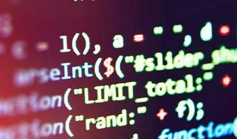 close up of code in yellow text against a dark red-black background