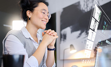 person looking at futuristic display at desk