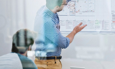 person working at whiteboard