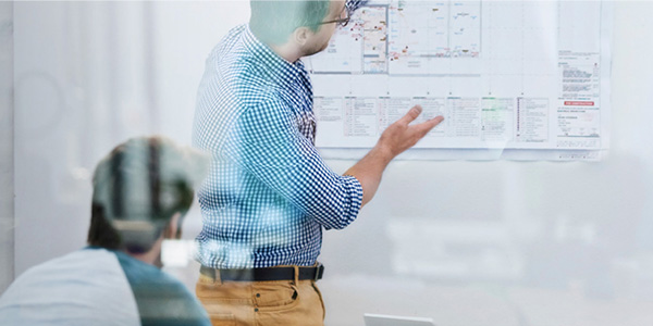 people meeting with whiteboard