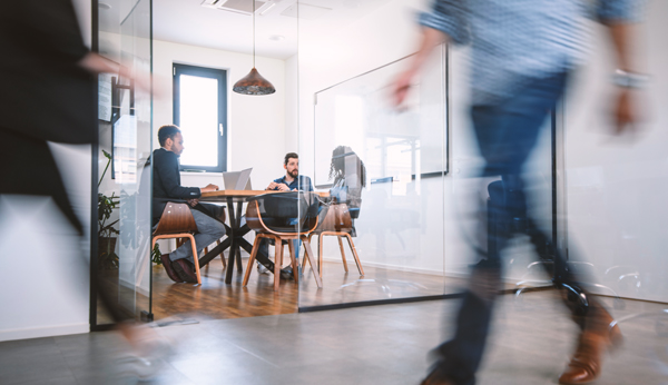 group of people conducting an interview in office