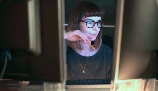 woman editing on computer