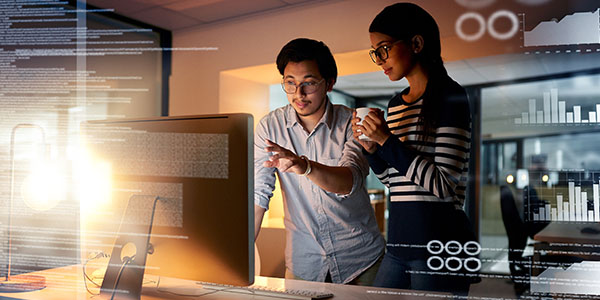 two people looking at monitor