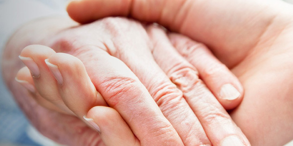 younger and older hands together