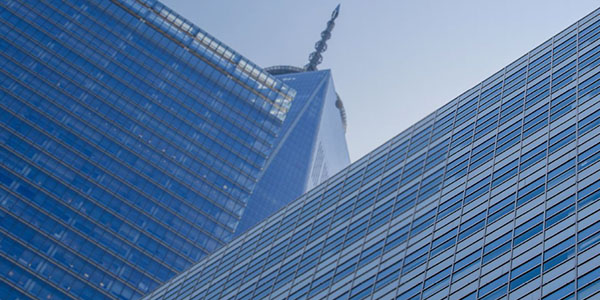 View of two commercial office buildings as if looking straight up