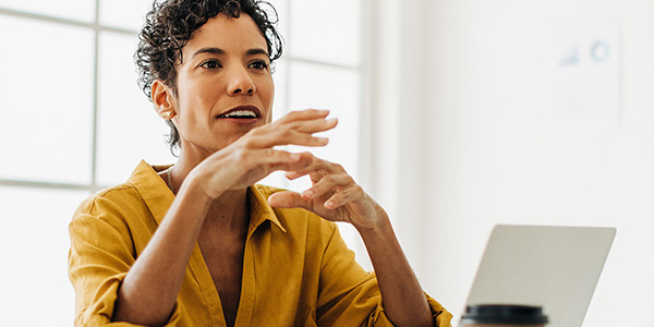person in meeting with laptop