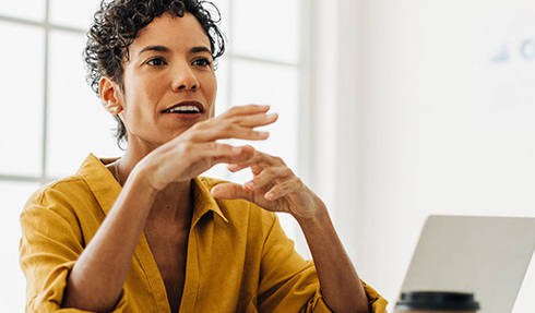 person in meeting with laptop