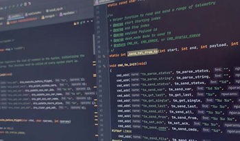 close up of code shown on two screens