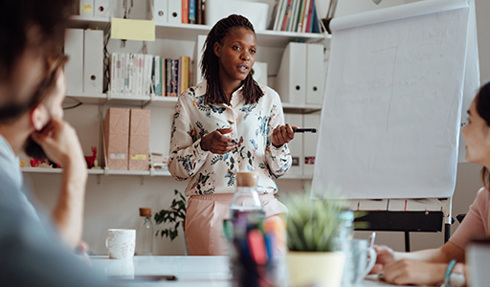 person presenting to colleagues